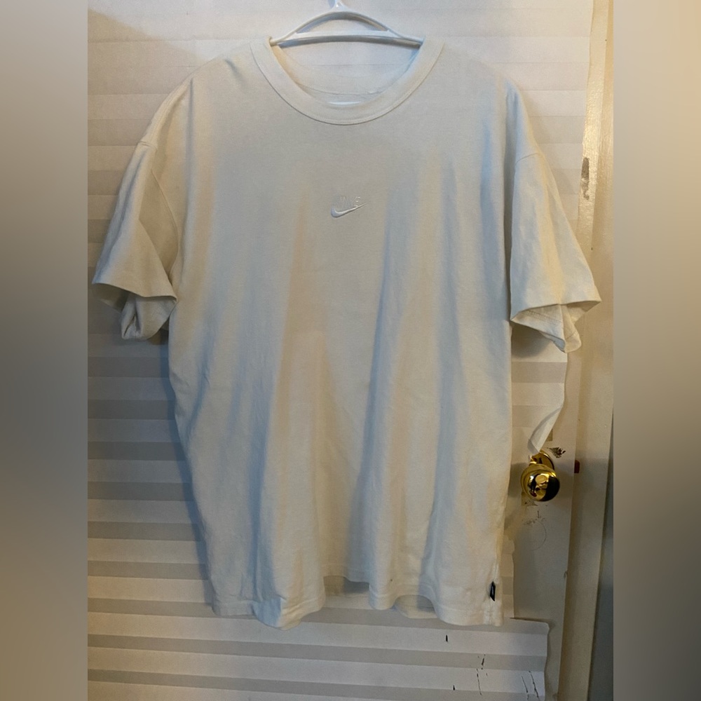 White Nike tee.